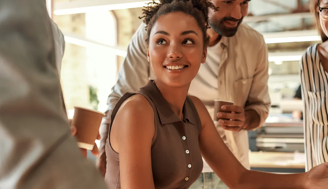 Partners collaborating over coffee in a shared office